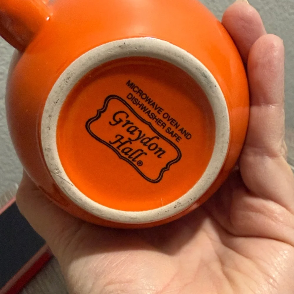 Orange Mug with Black Mustache Design